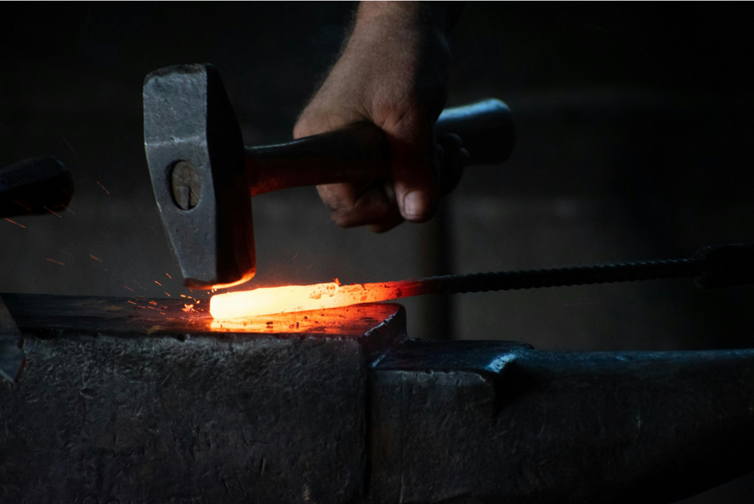A man forging a katana.