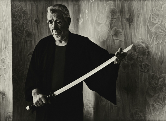 An old samurai holding a battle-ready katana.