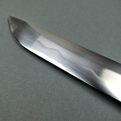 Close-up of polished blade edge of Musashi Tsuru Katana samurai sword showing detailed steel grain
